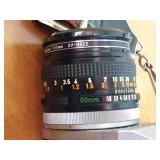 Vintage Canon SLR With Strap, Case, 50mm Lens, And Lens Filter