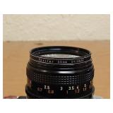 Vintage Canon SLR With Strap, Case, 50mm Lens, And Lens Filter