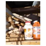 Top Shelf Full Of Scrap Wood, Chicago Electric Vibratory Bowl, Walnut Shells, Windshield Fluid, And Other Misc.
