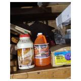 Top Shelf Full Of Scrap Wood, Chicago Electric Vibratory Bowl, Walnut Shells, Windshield Fluid, And Other Misc.