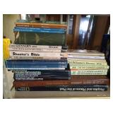 Stack of National Geographic Books and Atlas