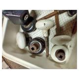 Small Bin With Several Antique Door Handles