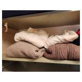 Rack of Designer Clothing & Sweater Shelf