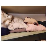 Rack of Designer Clothing & Sweater Shelf