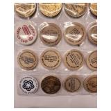 20 misc. tokens/wooden nickels in sheet