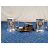 2 Aluminum 1987 Twins mugs with glass bottoms and a musical copper truck