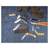 lot of knives and sheaths