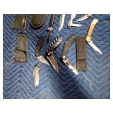 lot of knives and sheaths