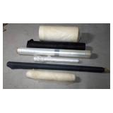 Rolls of upholstery backing material and rolls of plastic