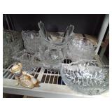 Shelf full of crystal and glassware and figurine