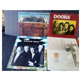 Rock and roll LP records and 2 stacks of various artists out of their sleeves