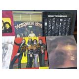 Rock and roll LP records and 2 stacks of various artists out of their sleeves