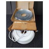 Rolls of vinyl and metal tacking strip