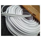 Rolls of vinyl and metal tacking strip