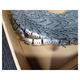 Rolls of vinyl and metal tacking strip