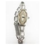 Benri  Vintage Filigree silver tone base metal Mechanical Watch. Winds.