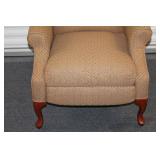 Elegant Wingback Armchair with Patterned Upholstery