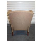 Elegant Wingback Armchair with Patterned Upholstery