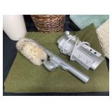 Variety of Bathmats, Wicker Trash Bin, Electric Duster, Power Strip, Large Green Throw (fleece/felt), Small White Trash Bin