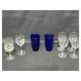 Set of 4 Wine Glasses, 2 Dark Blue Water Glasses, 1 Holiday Themed Wine Glass and 1 1999 Food and Wine Experience Wine Glass