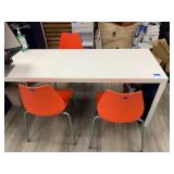 Corian Desk, Front counter, filing cabinet built in, 3 orange chairs, one barstool