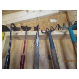 Lot of assorted garden hoes and wee...