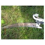 Manually operated tree trimming saw...