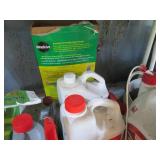 Shelf filled with lawn care product...