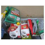 Shelf filled with lawn care product...