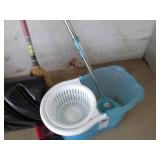 Corner lot of mops, step ladder, rakes & more