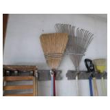 Corner lot of mops, step ladder, rakes & more