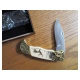 Commemorative folding knife in a wo...
