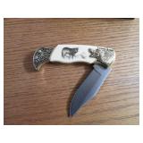 Commemorative folding knife in a wo...