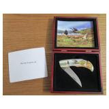 Commemorative folding knife in a wo...