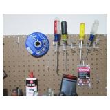 Assorted tools and peg board hooks...