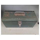 Green metal toolbox containing a la...