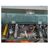 Green metal toolbox containing a la...