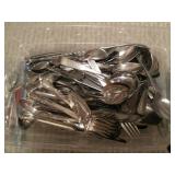 Assortment of silverware along with...