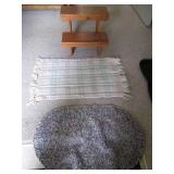 Wooden step stool and 2 rugs...