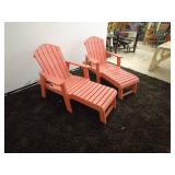 pair of red Composite Adirondack chairs each with footrest extensions.