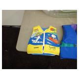 Lot of Adult and Youth Life Jackets and Inflatable Lounger
