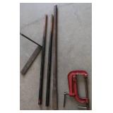 PICK, TWO HEAVY STEEL RODS, A STEEL L BRACKET, CLAMP