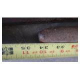 PICK, TWO HEAVY STEEL RODS, A STEEL L BRACKET, CLAMP