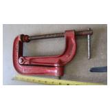 PICK, TWO HEAVY STEEL RODS, A STEEL L BRACKET, CLAMP