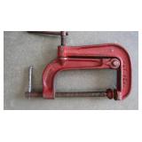 PICK, TWO HEAVY STEEL RODS, A STEEL L BRACKET, CLAMP