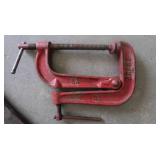 PICK, TWO HEAVY STEEL RODS, A STEEL L BRACKET, CLAMP