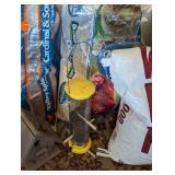 Partial Bags of Birdseed and Feeders