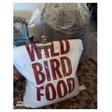 Partial Bags of Birdseed and Feeders