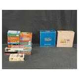 Collection of Trivial Pursuit Board Games and VHS Tapes