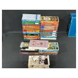 Collection of Trivial Pursuit Board Games and VHS Tapes